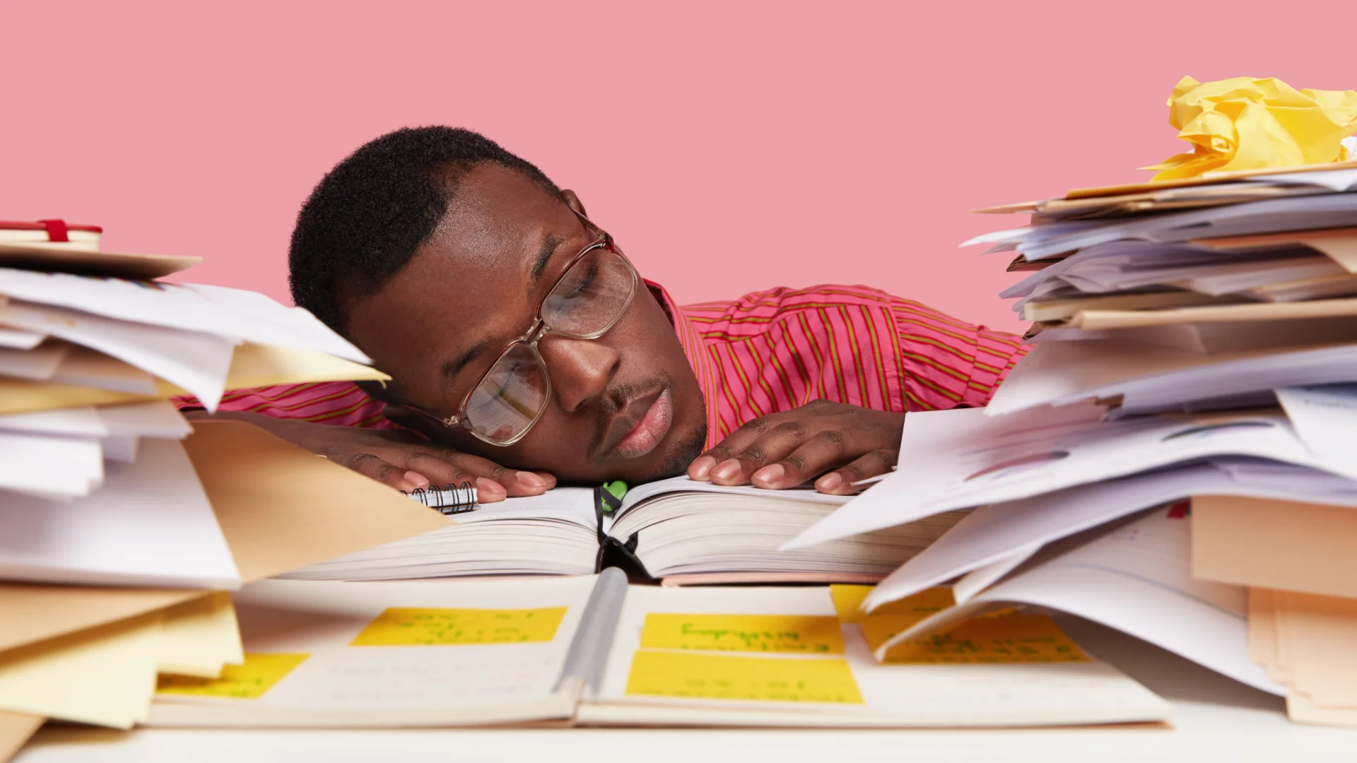 Office worker asleep at desk symbolising a website that isn’t doing its job.
